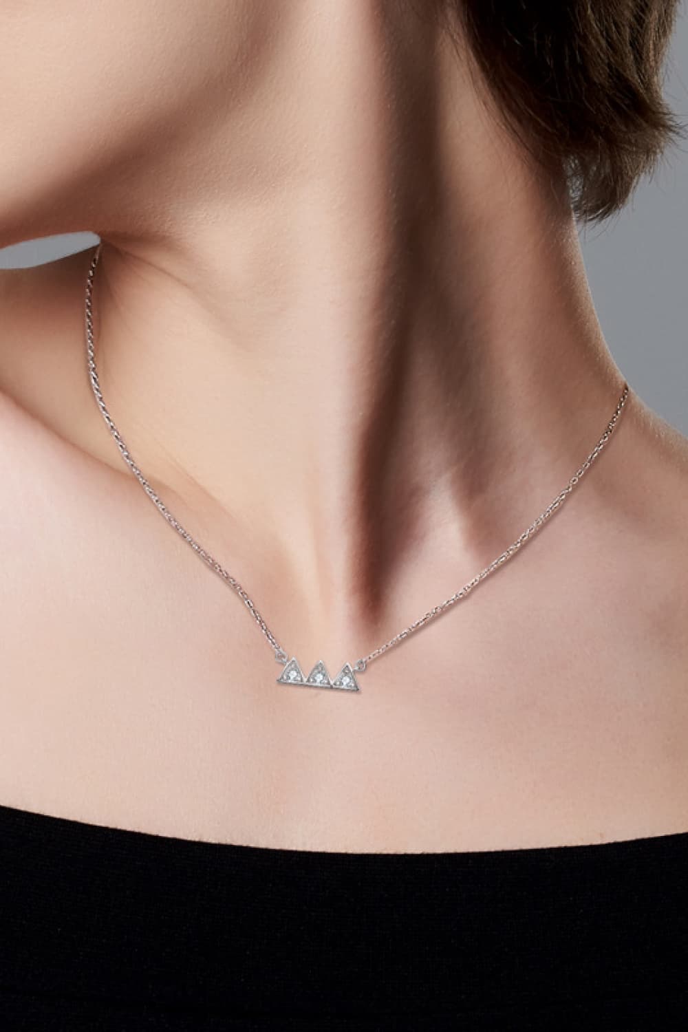 Moissanite Triangle Platinum-Plated Necklace around neck