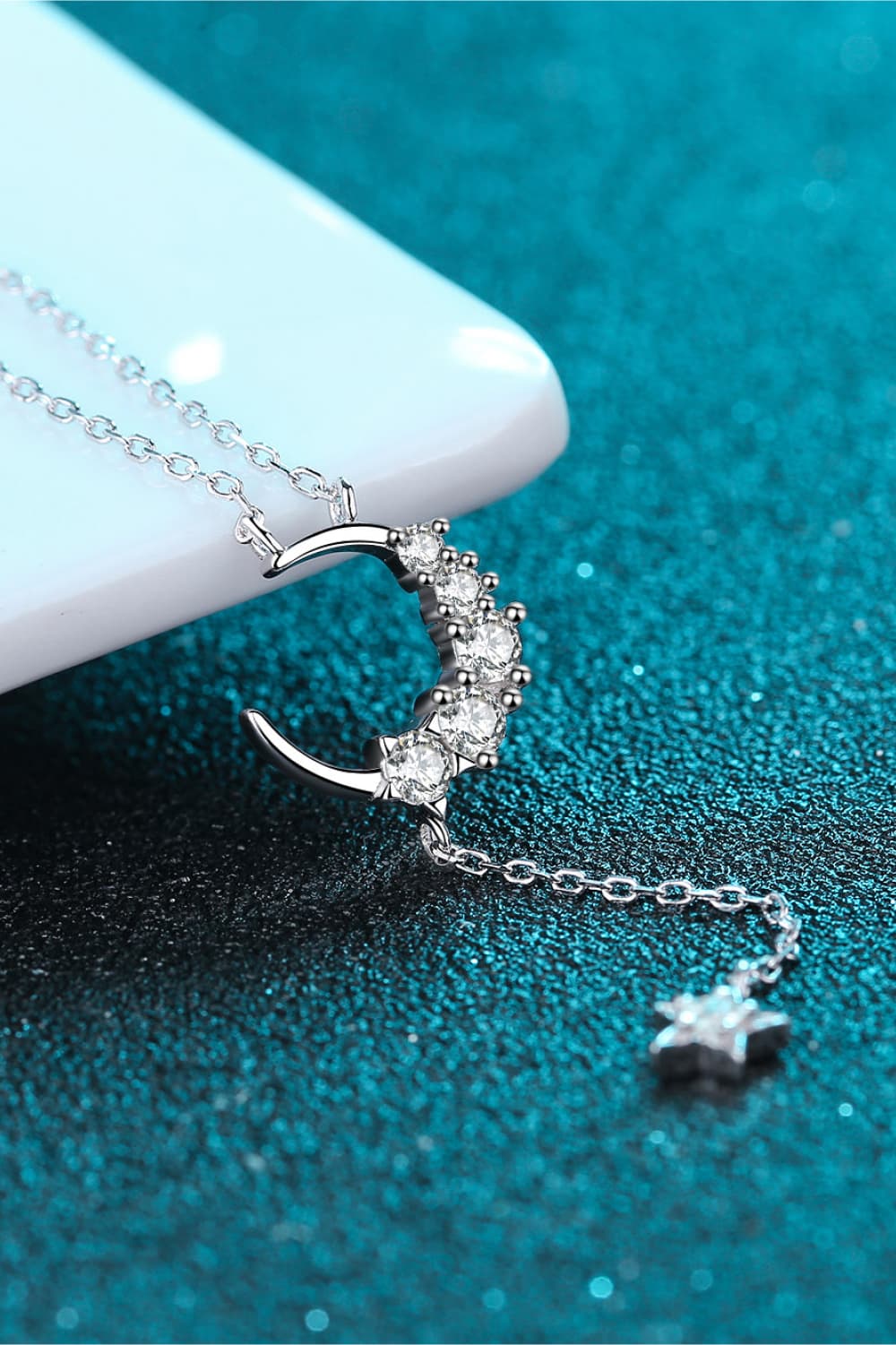 Star & Moon Moissanite Necklace on display