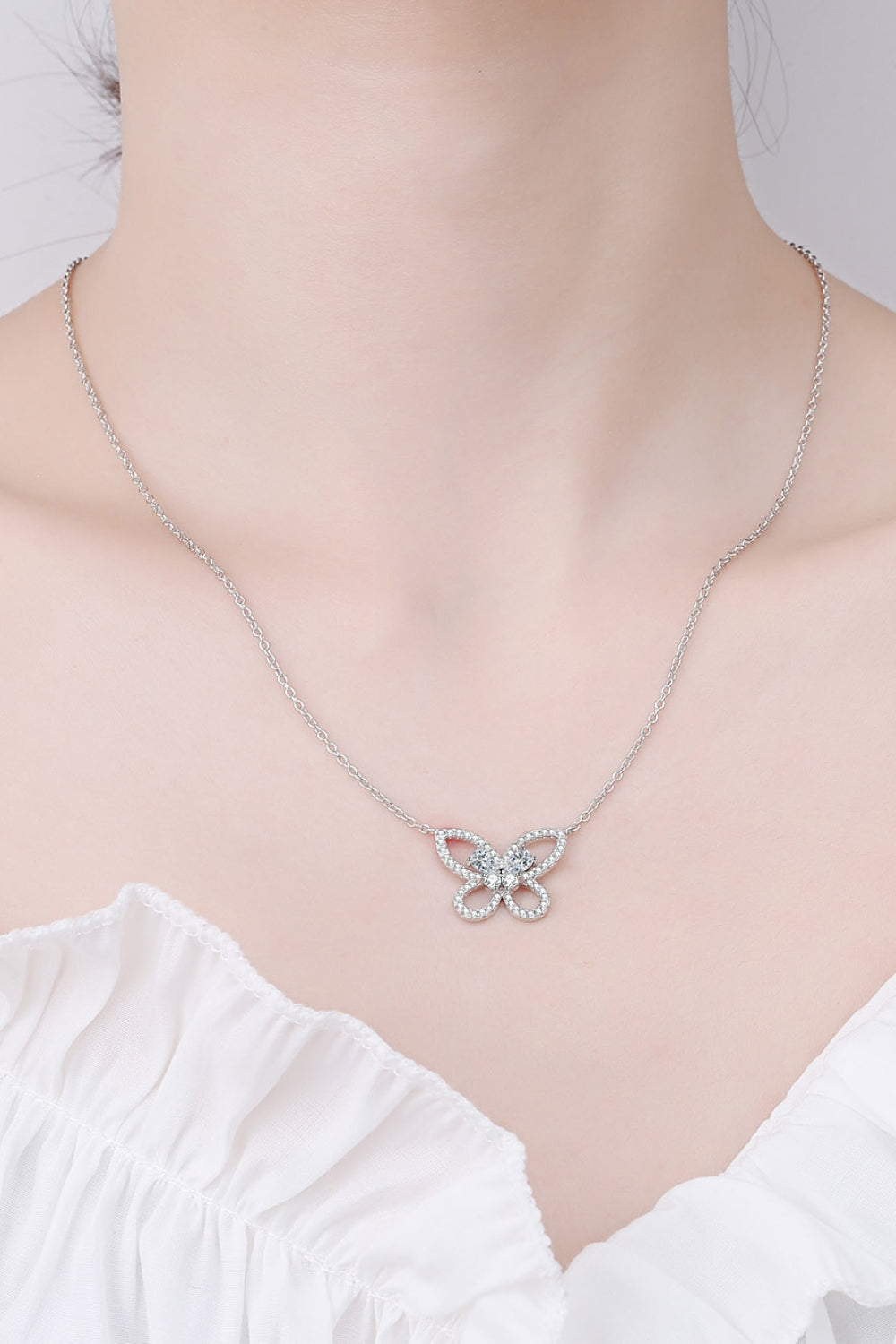 Moissanite Butterfly Pendant Necklace around neck