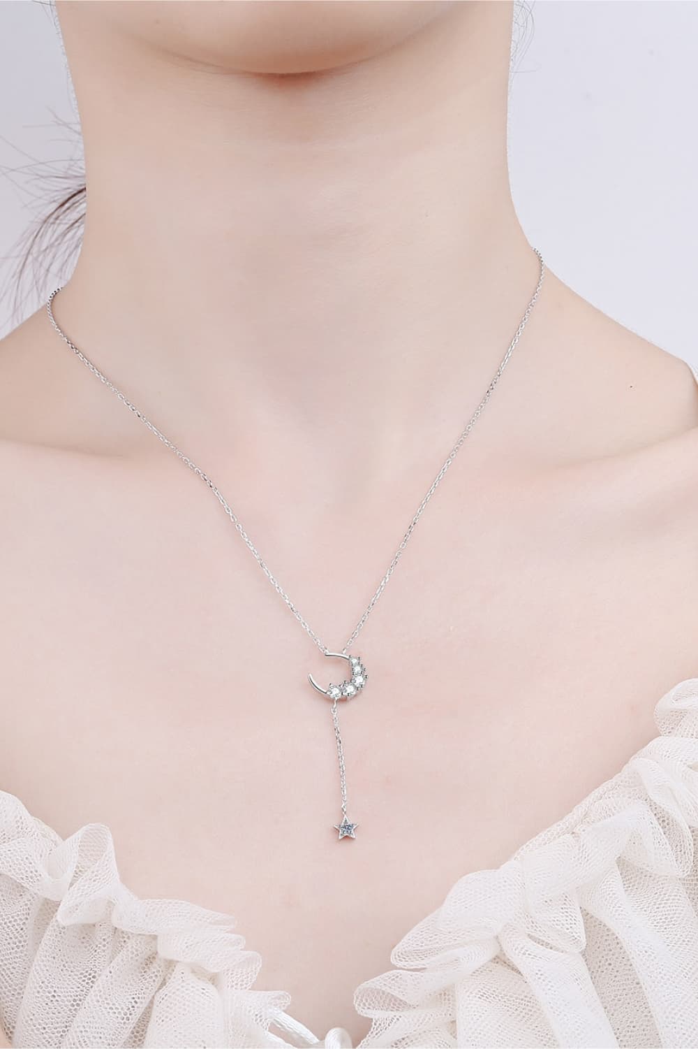 Star & Moon Moissanite Necklace around neck