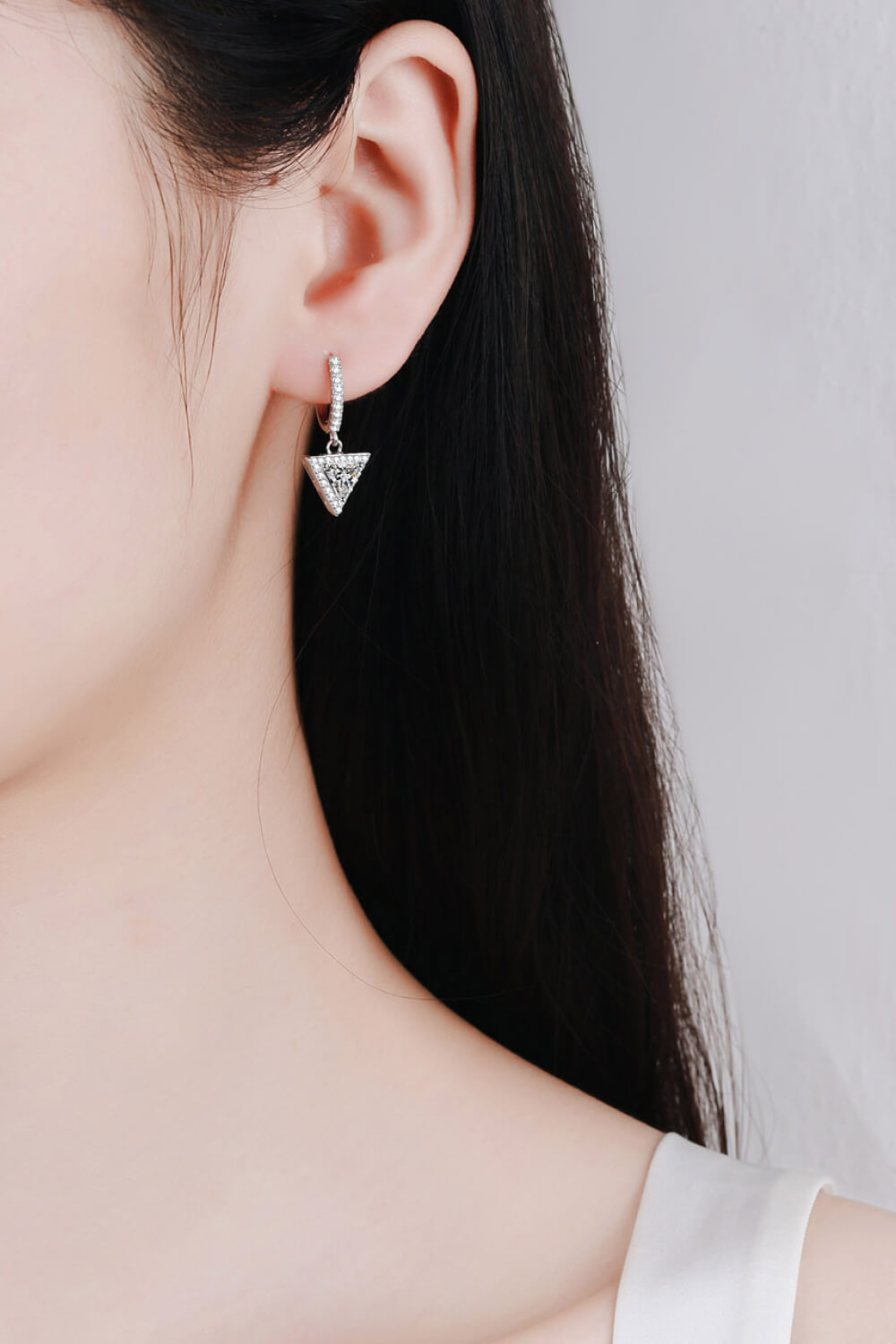 Moissanite Triangle Drop Earrings on ears