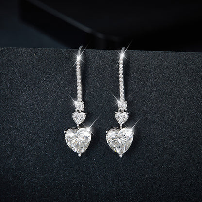 5.44 Carat Sterling Silver Moissanite Heart Drop Earrings on display