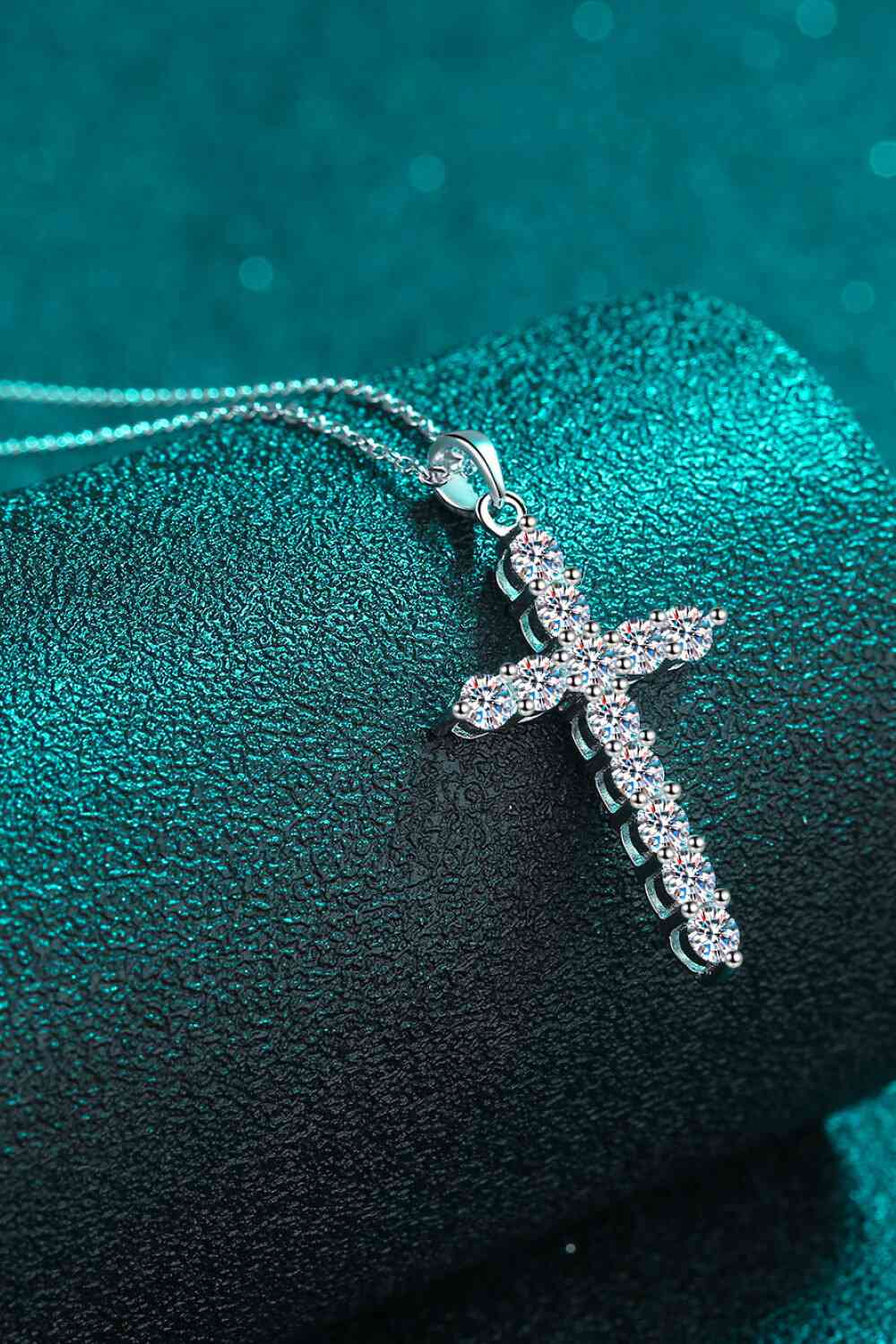Moissanite Cross Pendant Chain Necklace on display