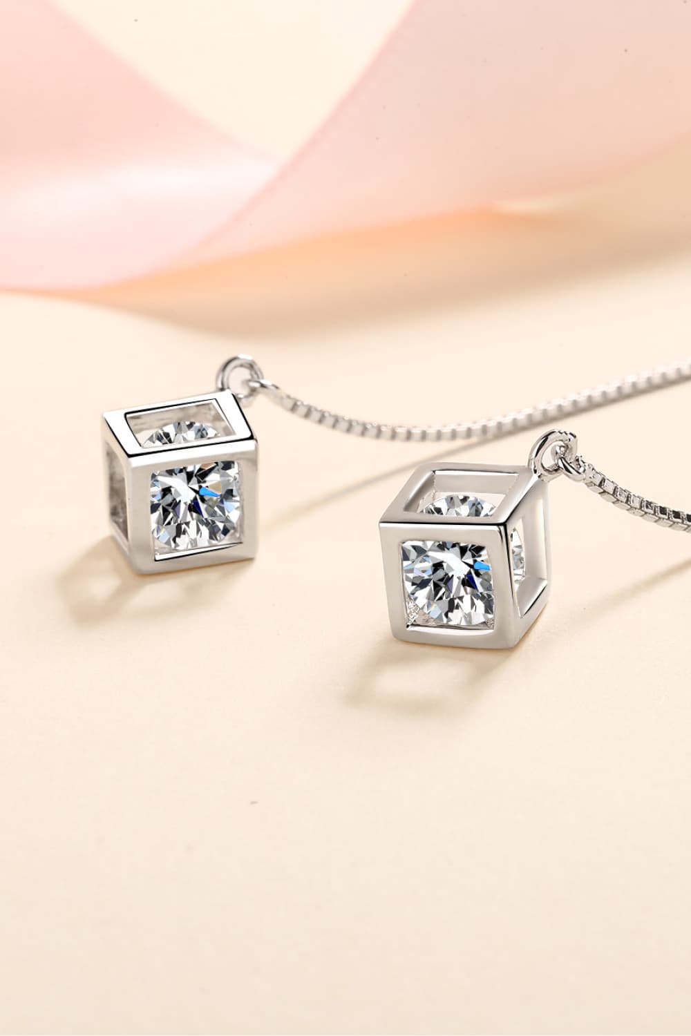 2 Carat Moissanite Sterling Silver Threader Earrings on display