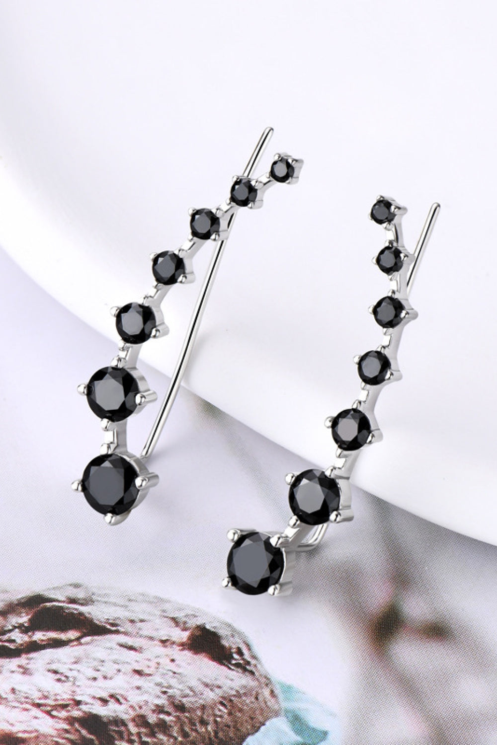1.9 Carat Moissanite Sterling Silver Earrings black on display