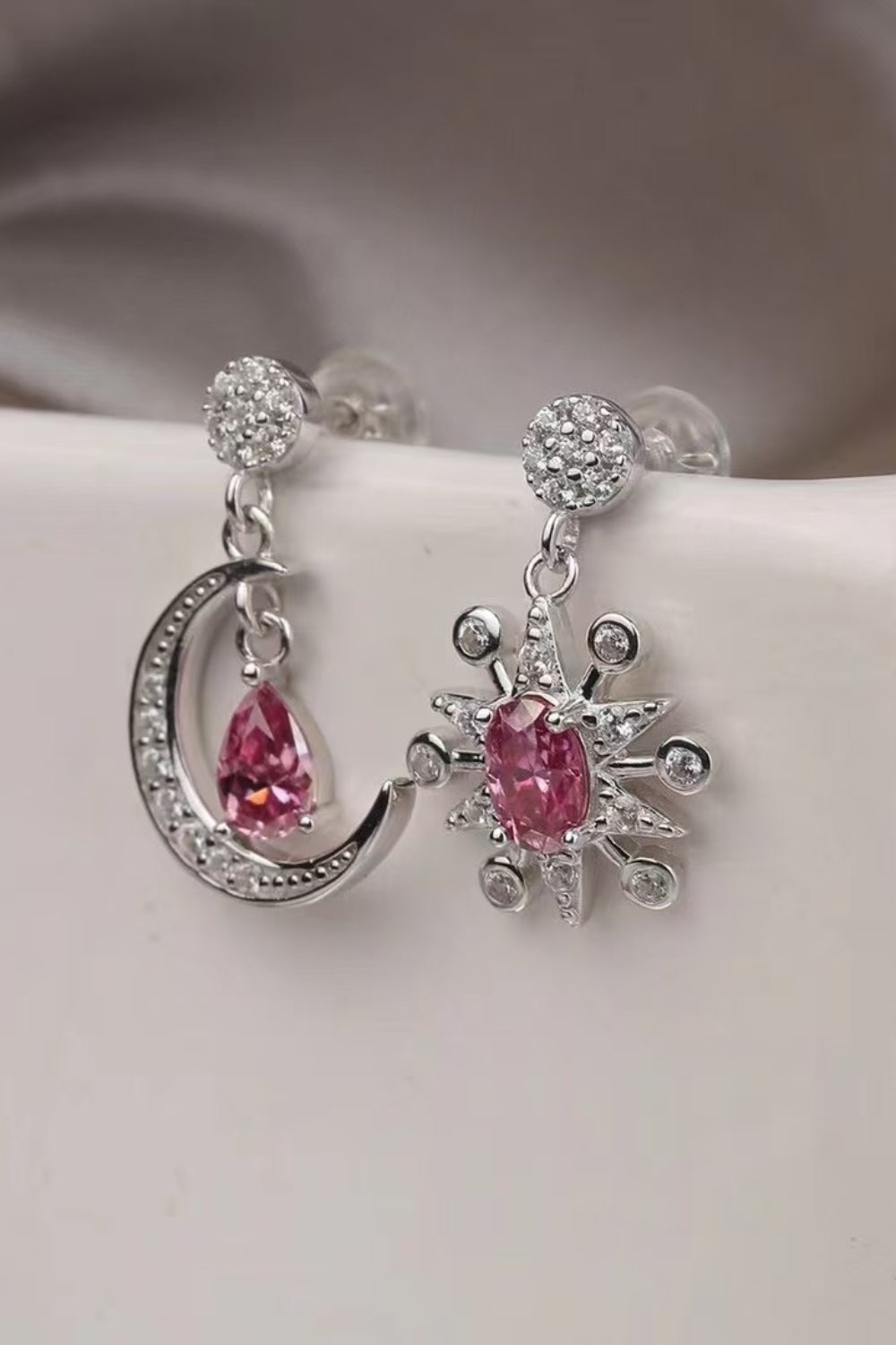 2 Carat Moissanite Sterling Silver Moon & Star Earrings on display