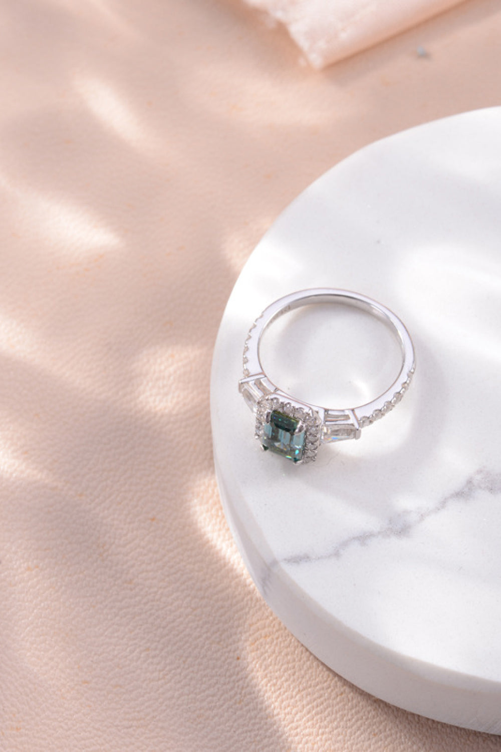 Green 1 Carat Moissanite 925 Sterling Silver Ring on display